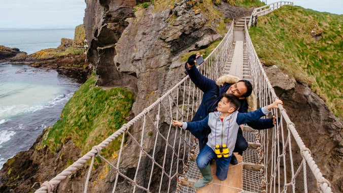 Visitors taking a selfie on Carrick-a-Rede Rope Bridge, Co. Antrim